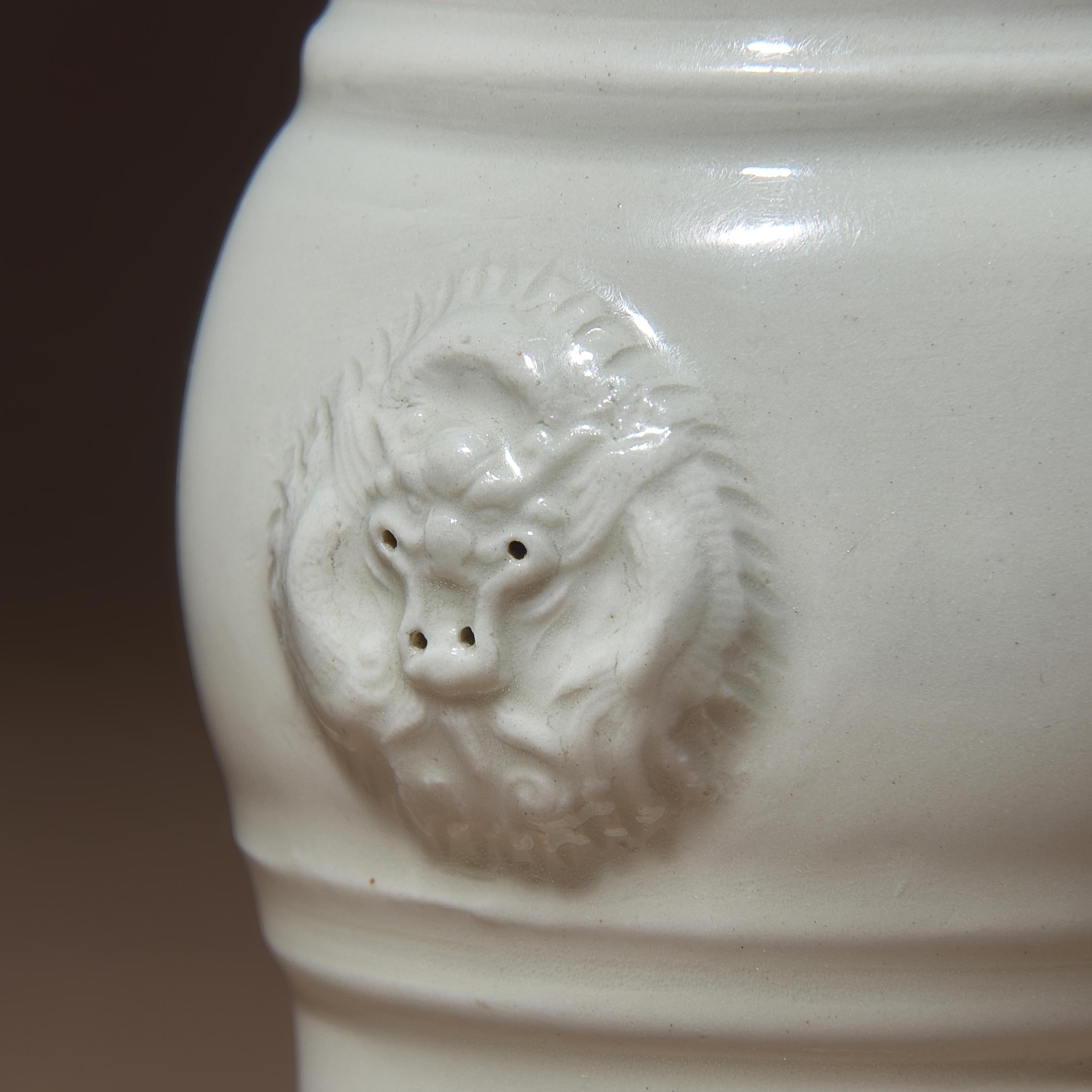 Two Chinese Blanc-de-Chine Porcelain Vases, 17th-18th Century — 清中期 德化白瓷雙輔首耳筒瓶及花觚