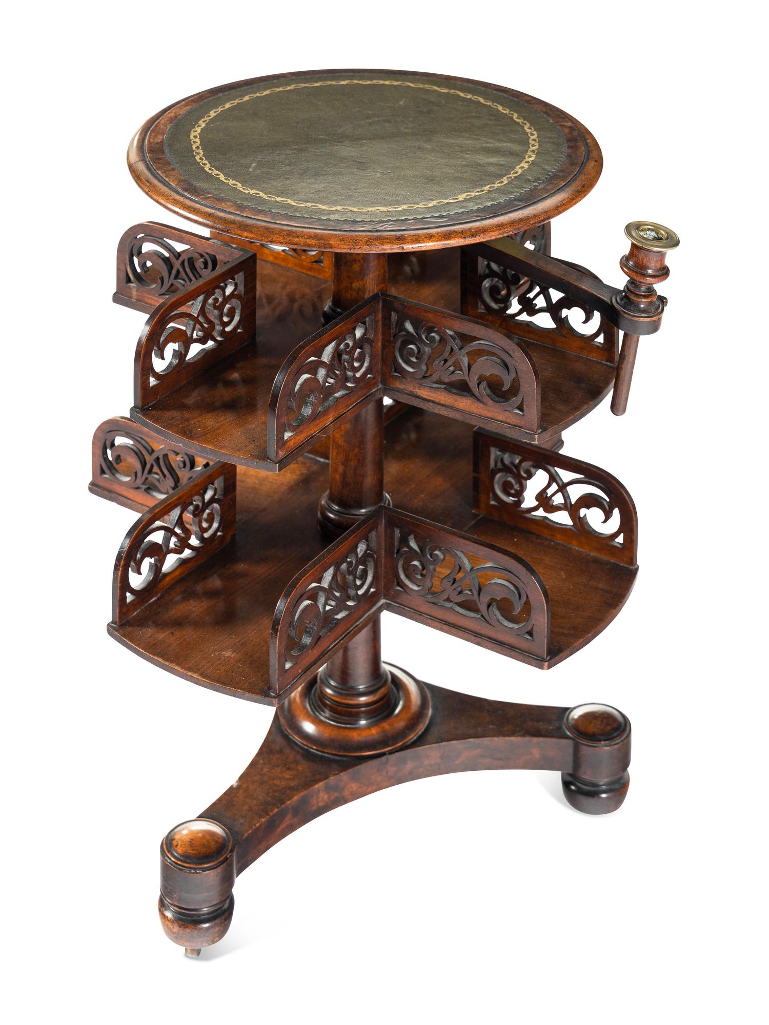 A William IV Mahogany Revolving Book Stand with Candle Branch