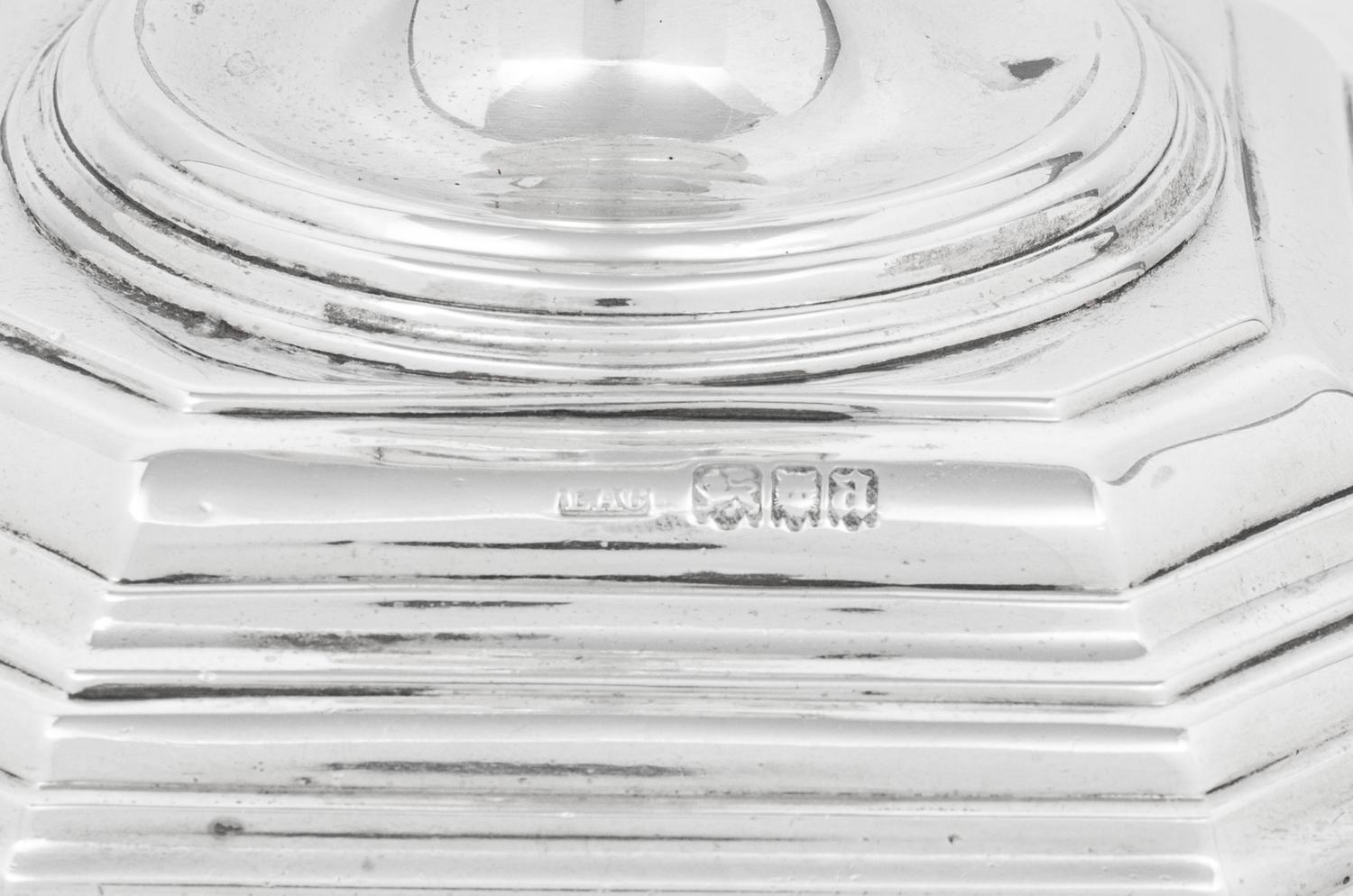 A Set of Four English Silver Candlesticks