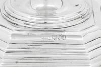 A Set of Four English Silver Candlesticks