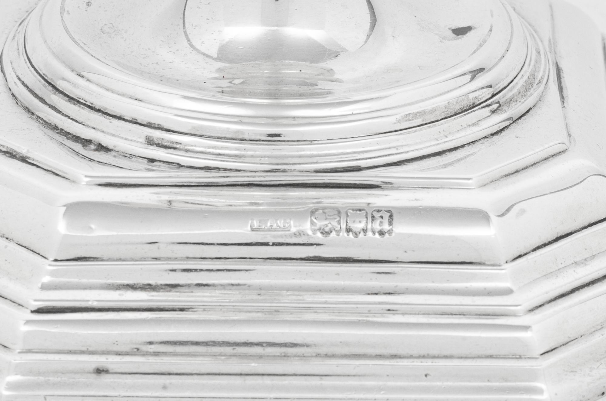 A Set of Four English Silver Candlesticks
