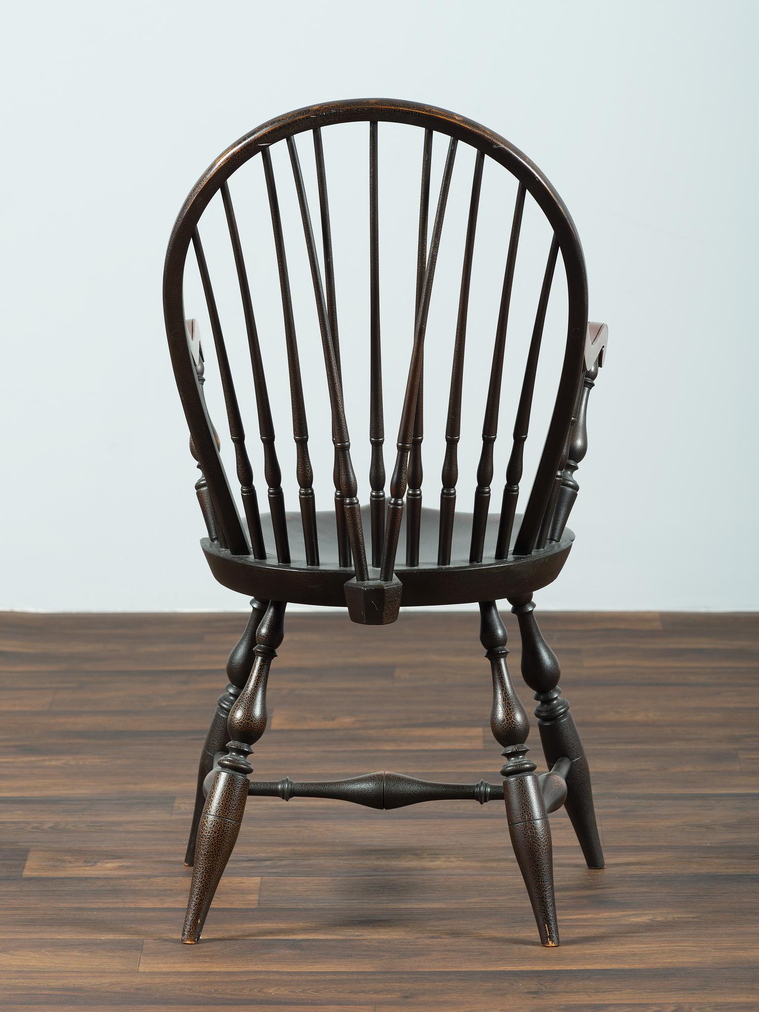 A D.R. Dimes Black-Painted Brace-Back Compass-Seat Windsor Armchair