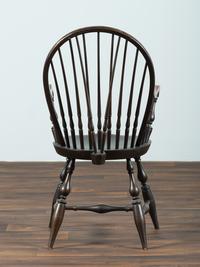 A D.R. Dimes Black-Painted Brace-Back Compass-Seat Windsor Armchair
