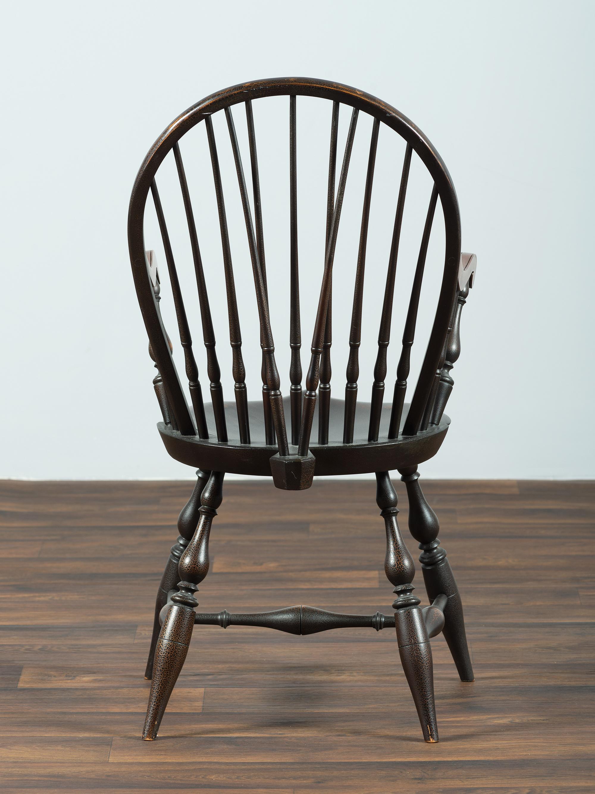A D.R. Dimes Black-Painted Brace-Back Compass-Seat Windsor Armchair