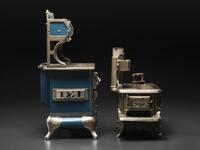 A Qualified Range Co. Salesman Sample Stove and a Rival Toy Stove