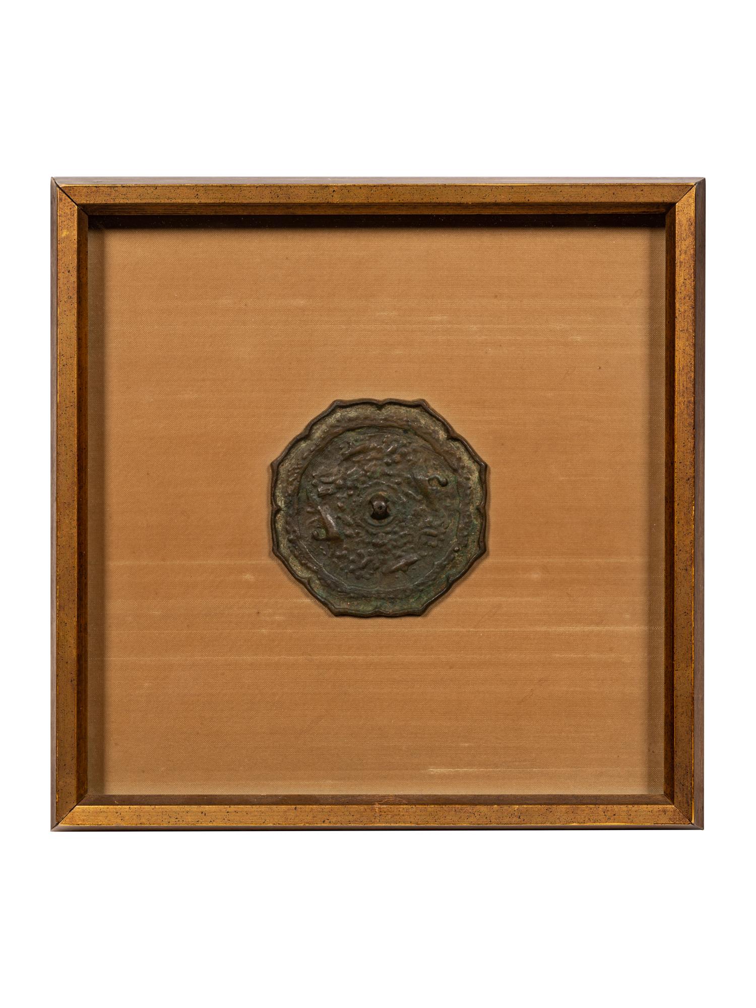 A Bronze Octafoil 'Mythical Beasts' Mirror