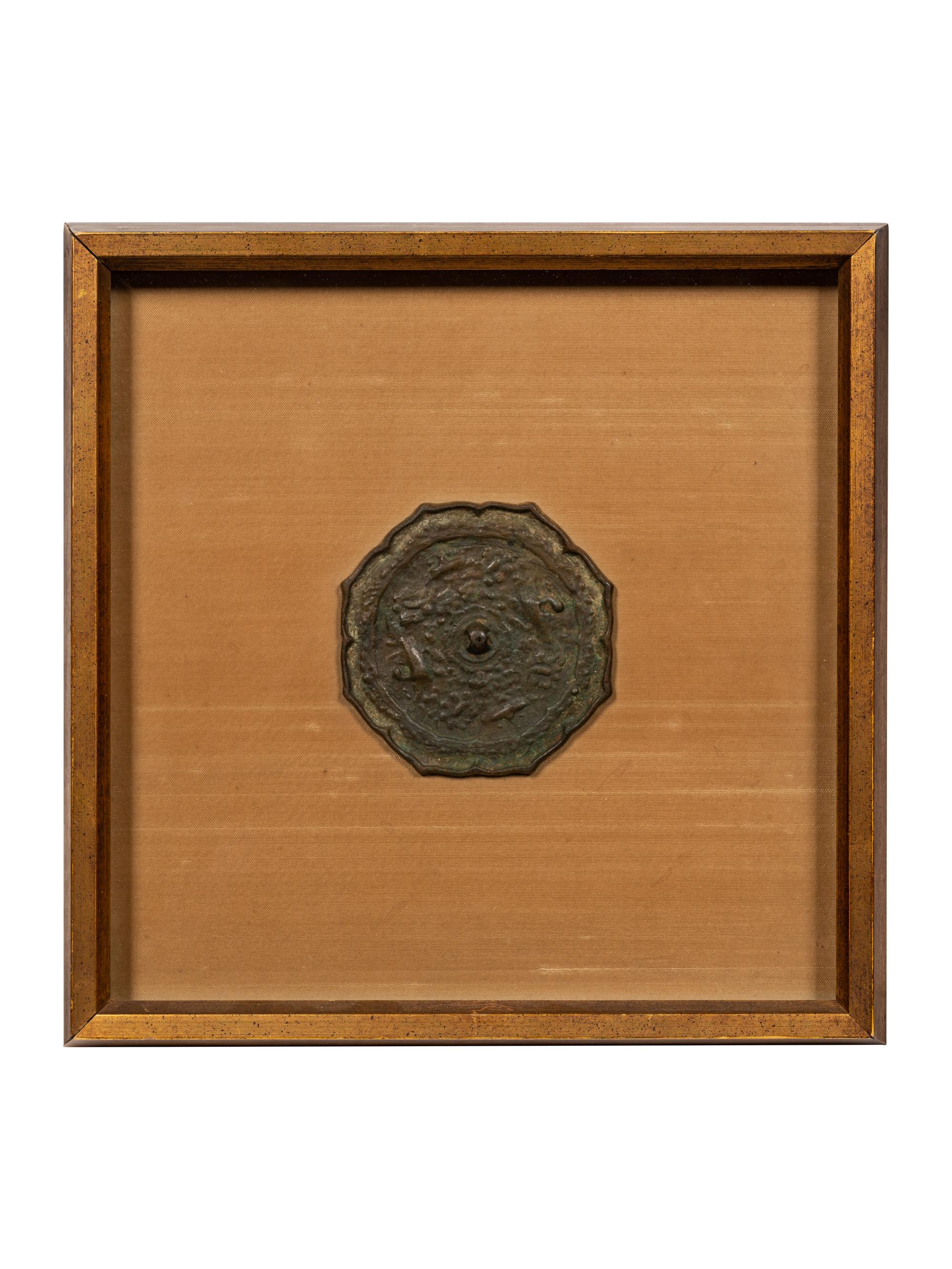 A Bronze Octafoil 'Mythical Beasts' Mirror