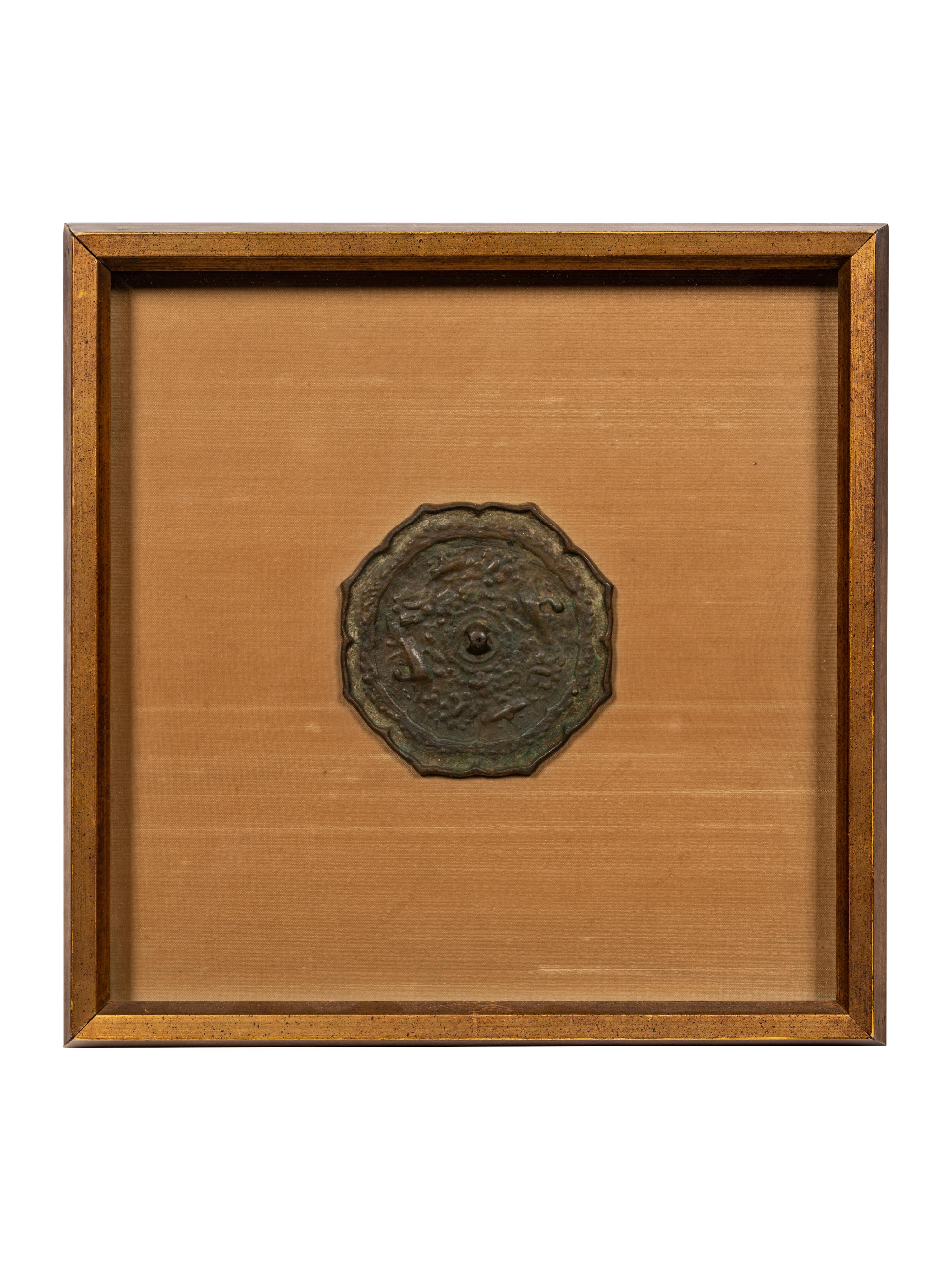 A Bronze Octafoil 'Mythical Beasts' Mirror
