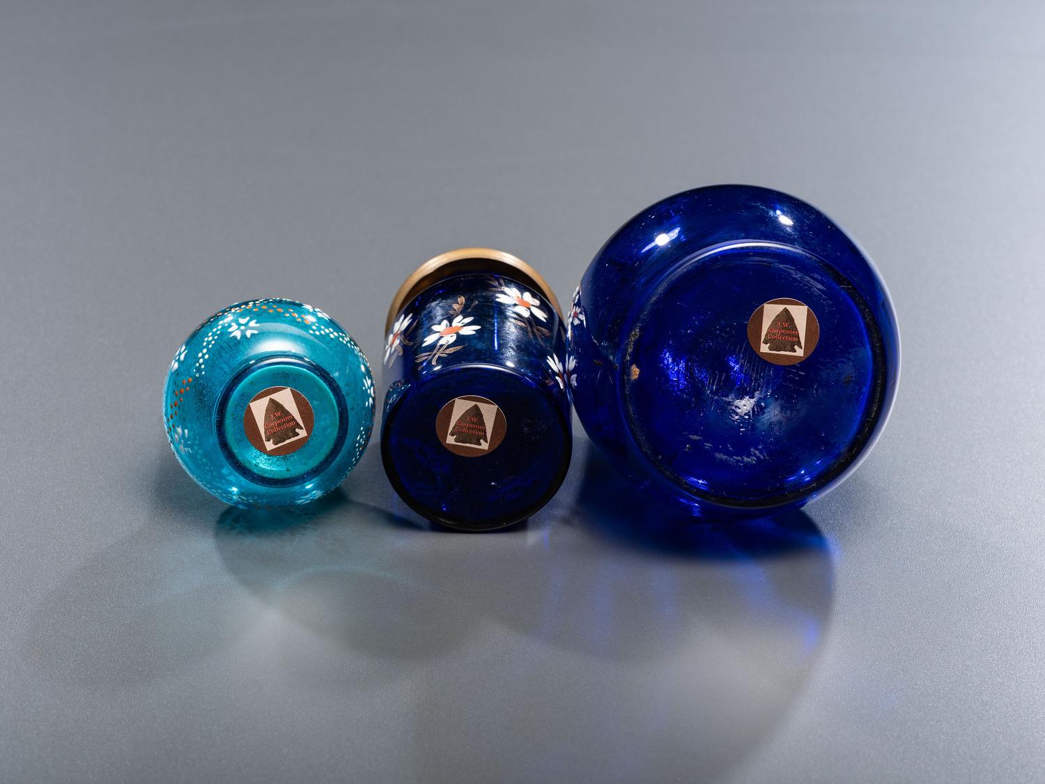 Seven Enameled Glass Barber Items