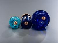 Seven Enameled Glass Barber Items