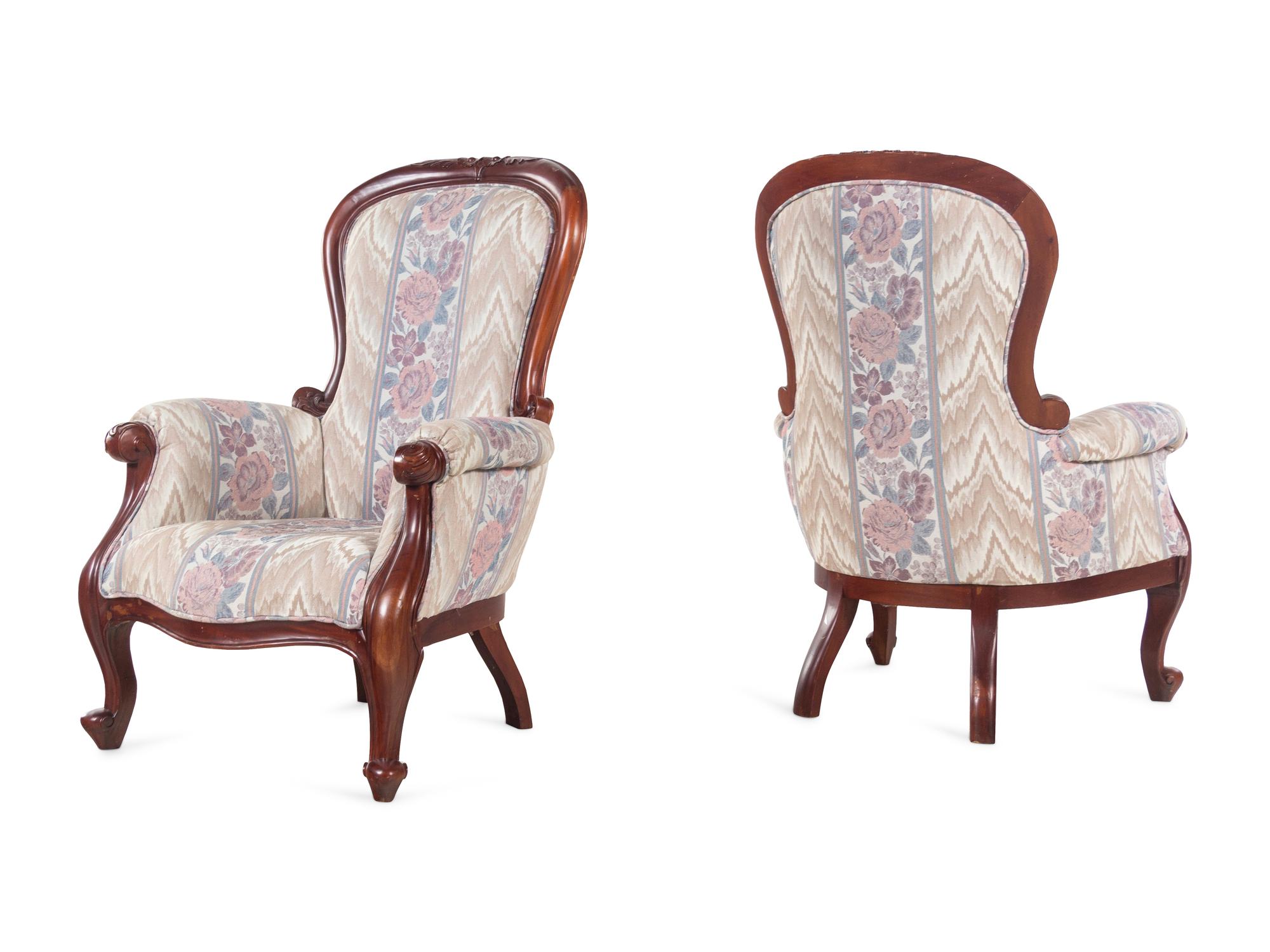 A Pair of Victorian Style Carved Walnut Armchairs