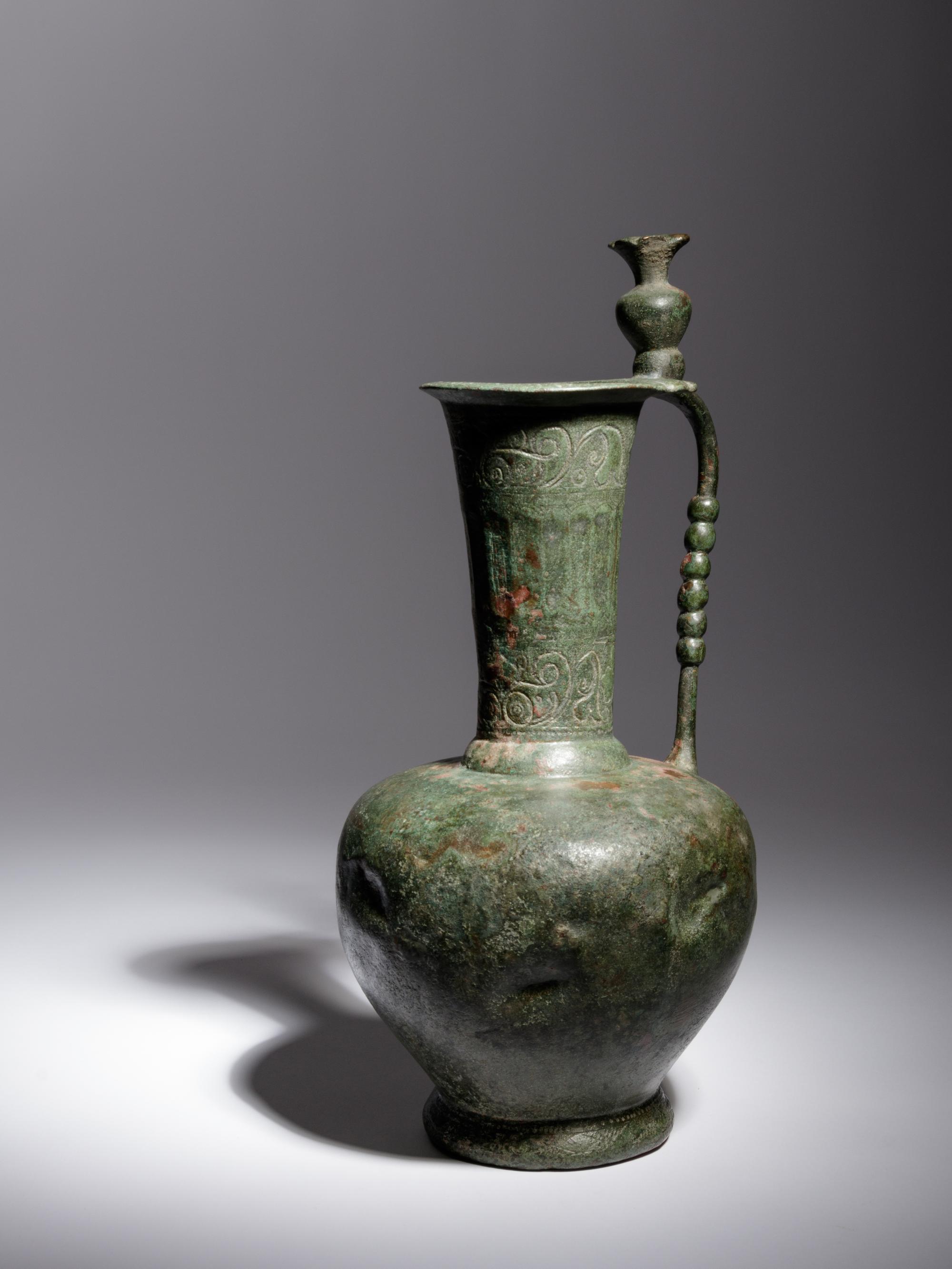 An Umayyad or Early Abbasid Bronze Ewer with a Pomegranate
