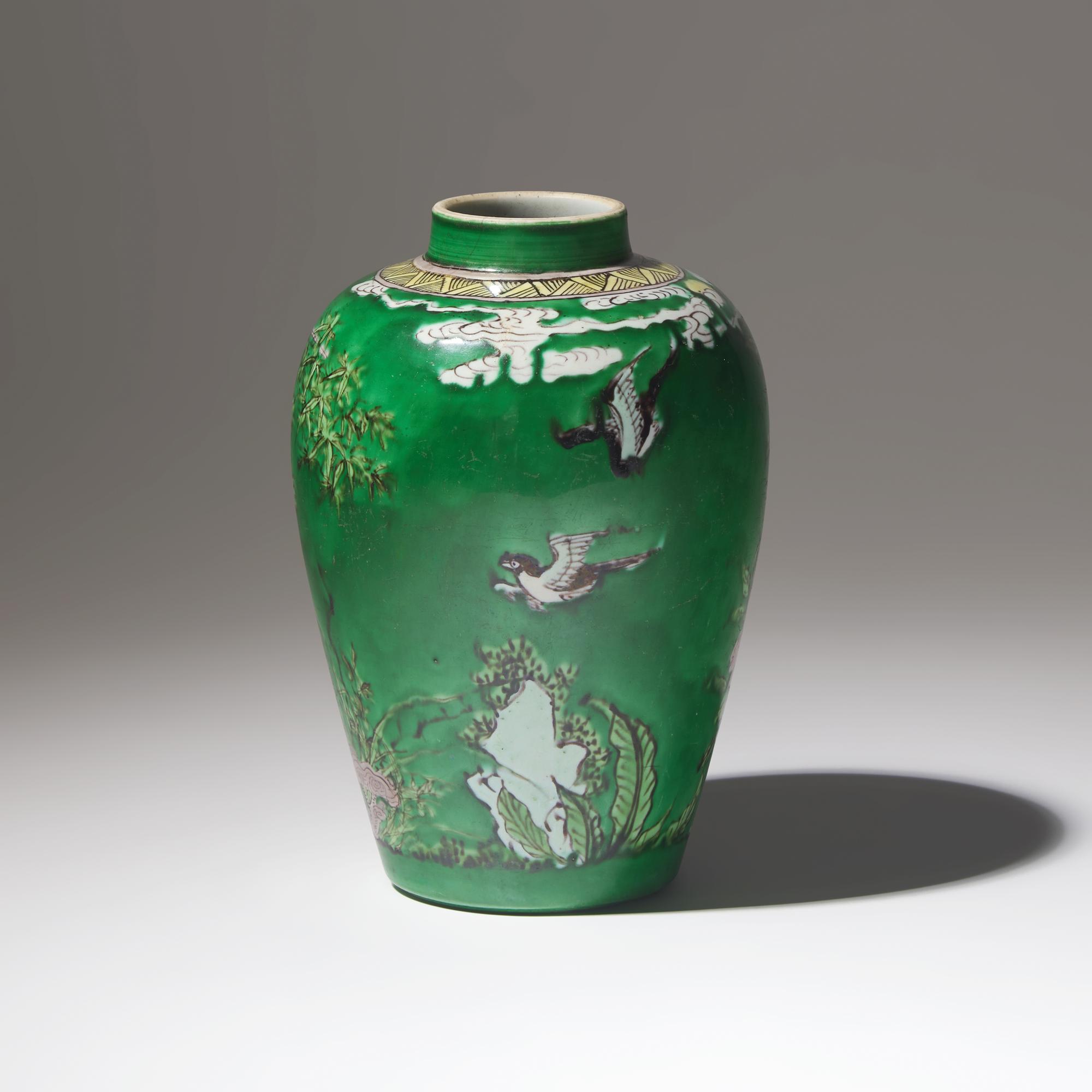 A Chinese Green Ground 'Birds and Bamboo' Porcelain Jar, Kangxi Period — 清康熙 綠彩繪花鳥竹石罐