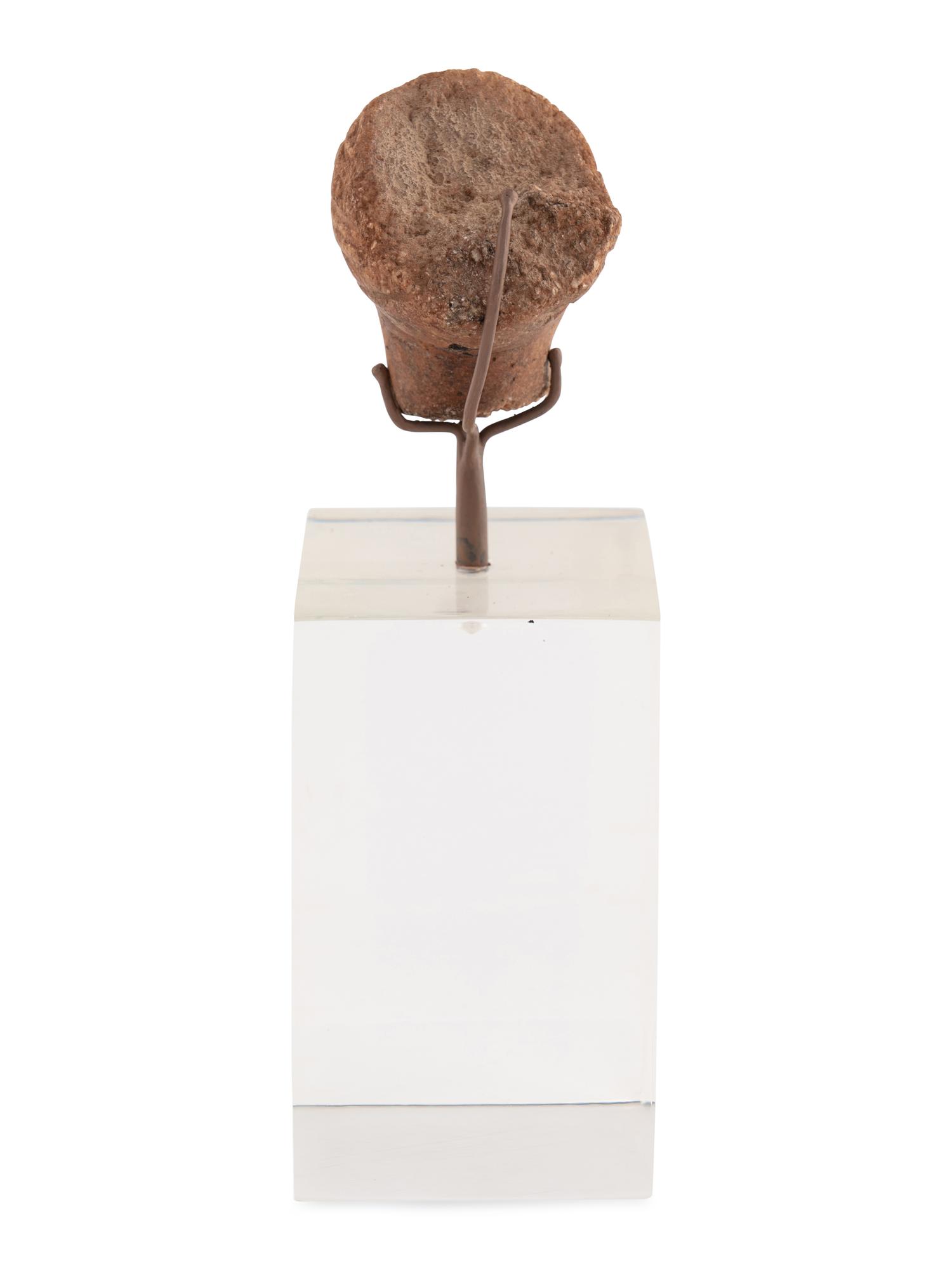A Roman Stone Head of a Woman