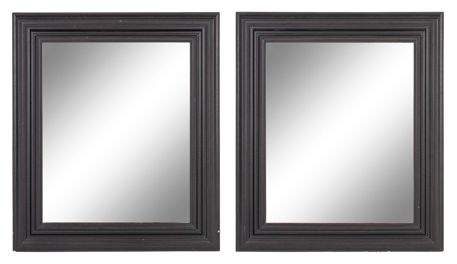A Pair of Flemish Style Ebonized Ripple Molded Mirrors