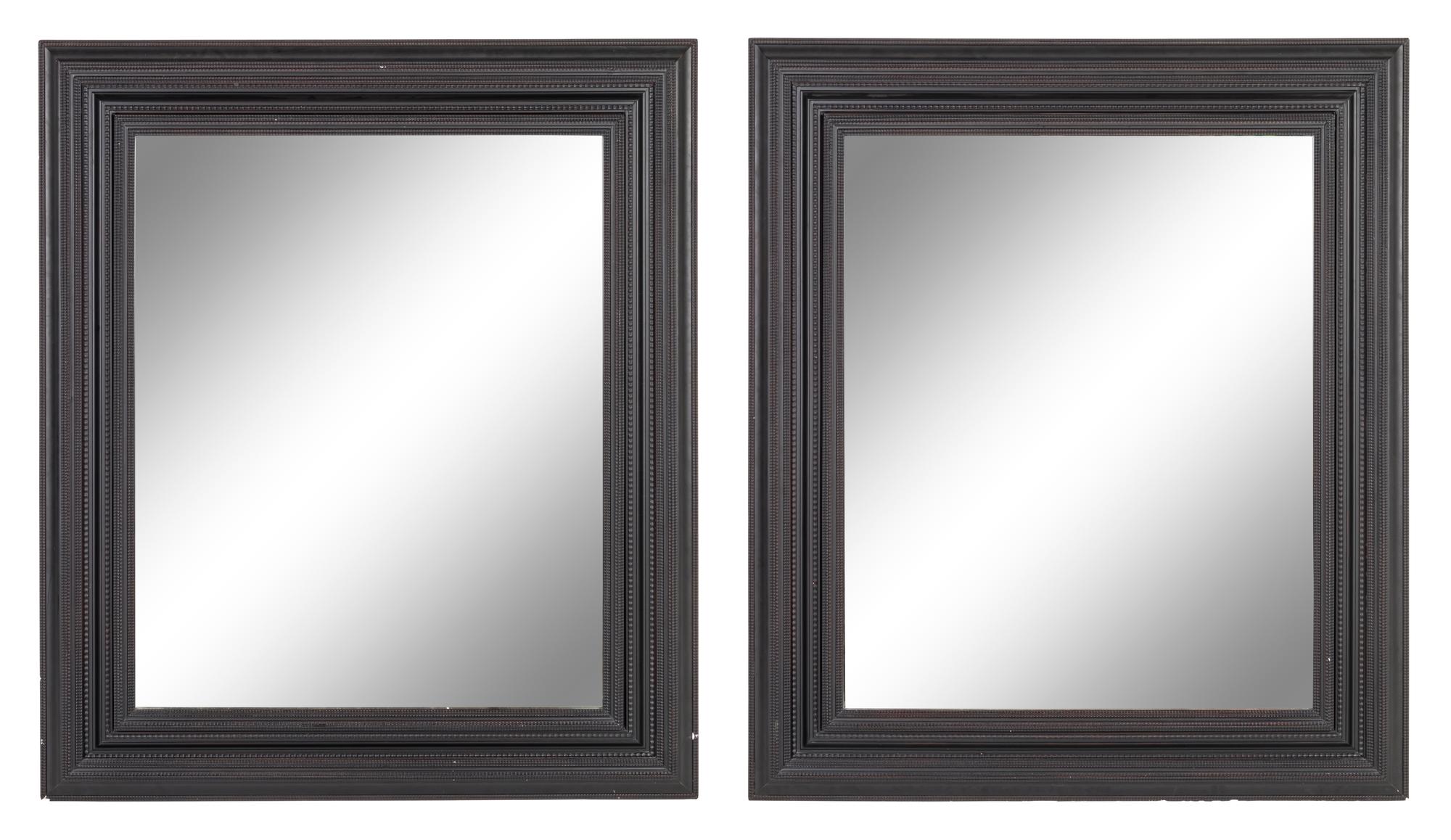 A Pair of Flemish Style Ebonized Ripple Molded Mirrors