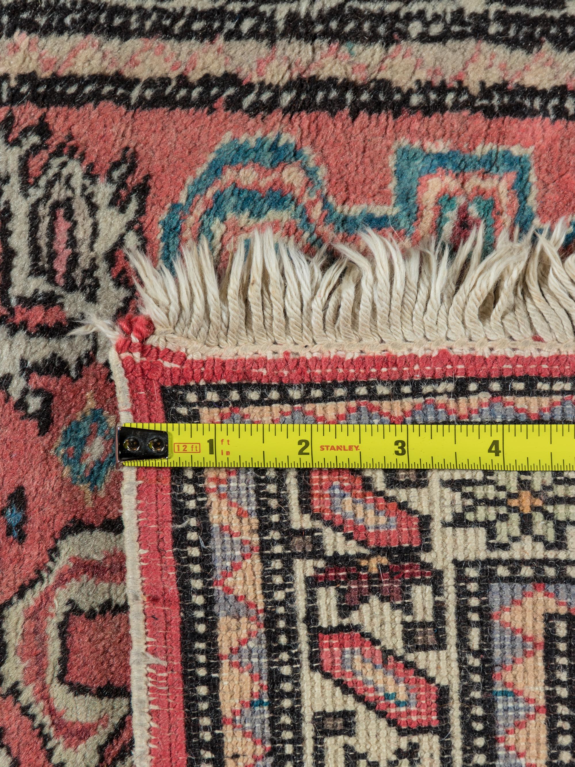 A Peperdil Wool Rug