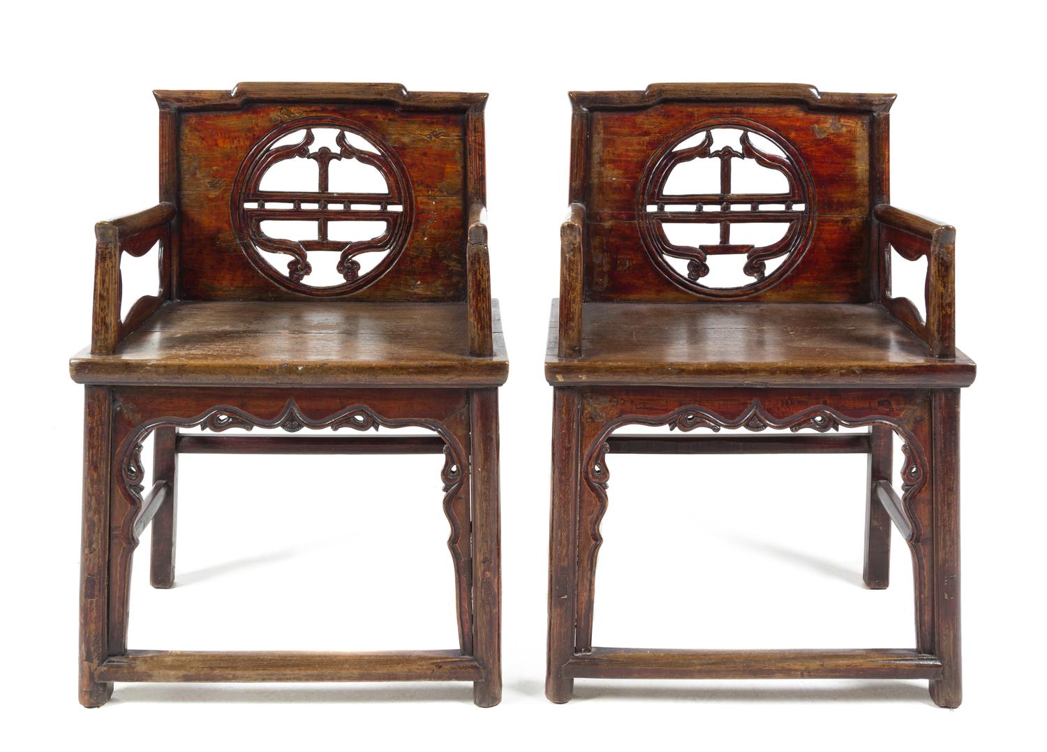 A Pair of Chinese Nanmu Wood Chairs Height 33 1/2 inches.