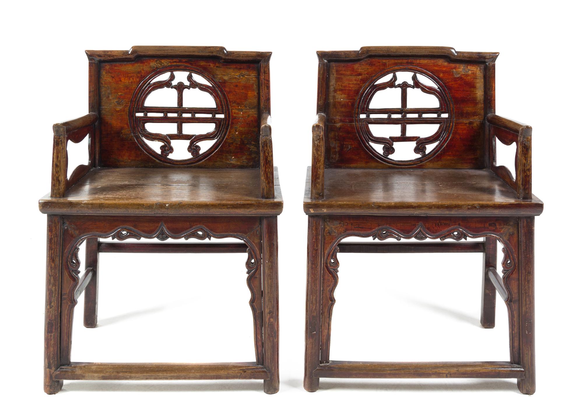A Pair of Chinese Nanmu Wood Chairs Height 33 1/2 inches.