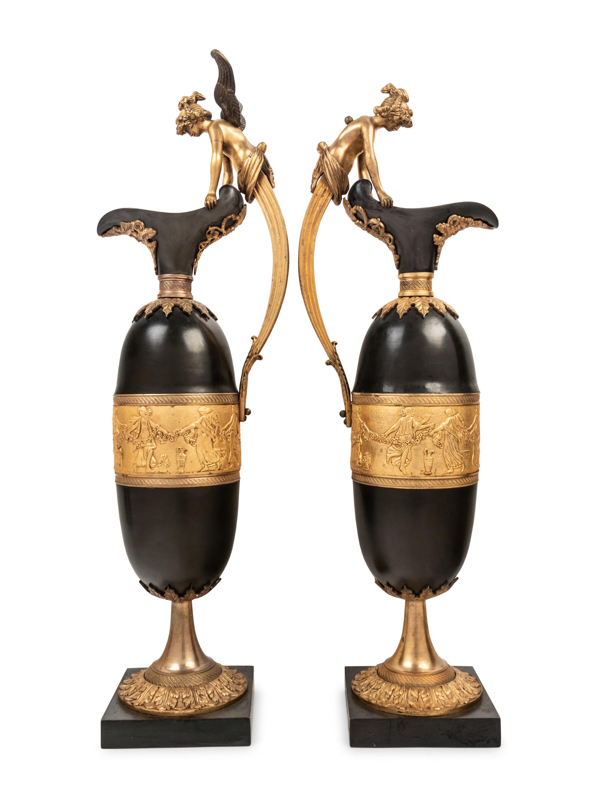 A Pair of Continental Gilt and Patinated Bronze Ewers