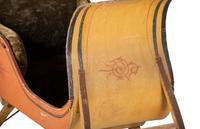 A Paint Decorated and Velvet Upholstered Wood Child's Sleigh