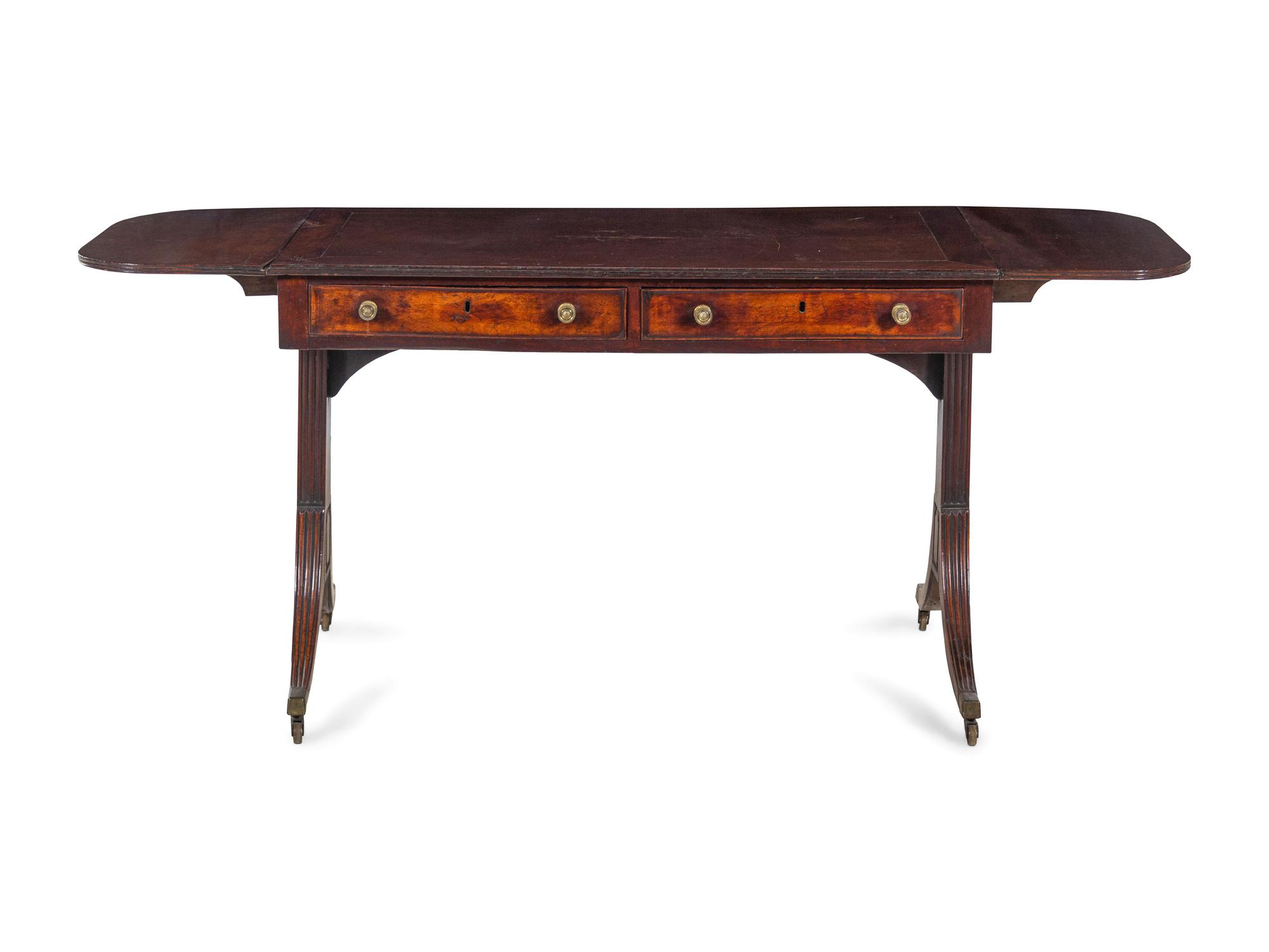 A George III Figured and Brass-Mounted Mahogany Sofa Table