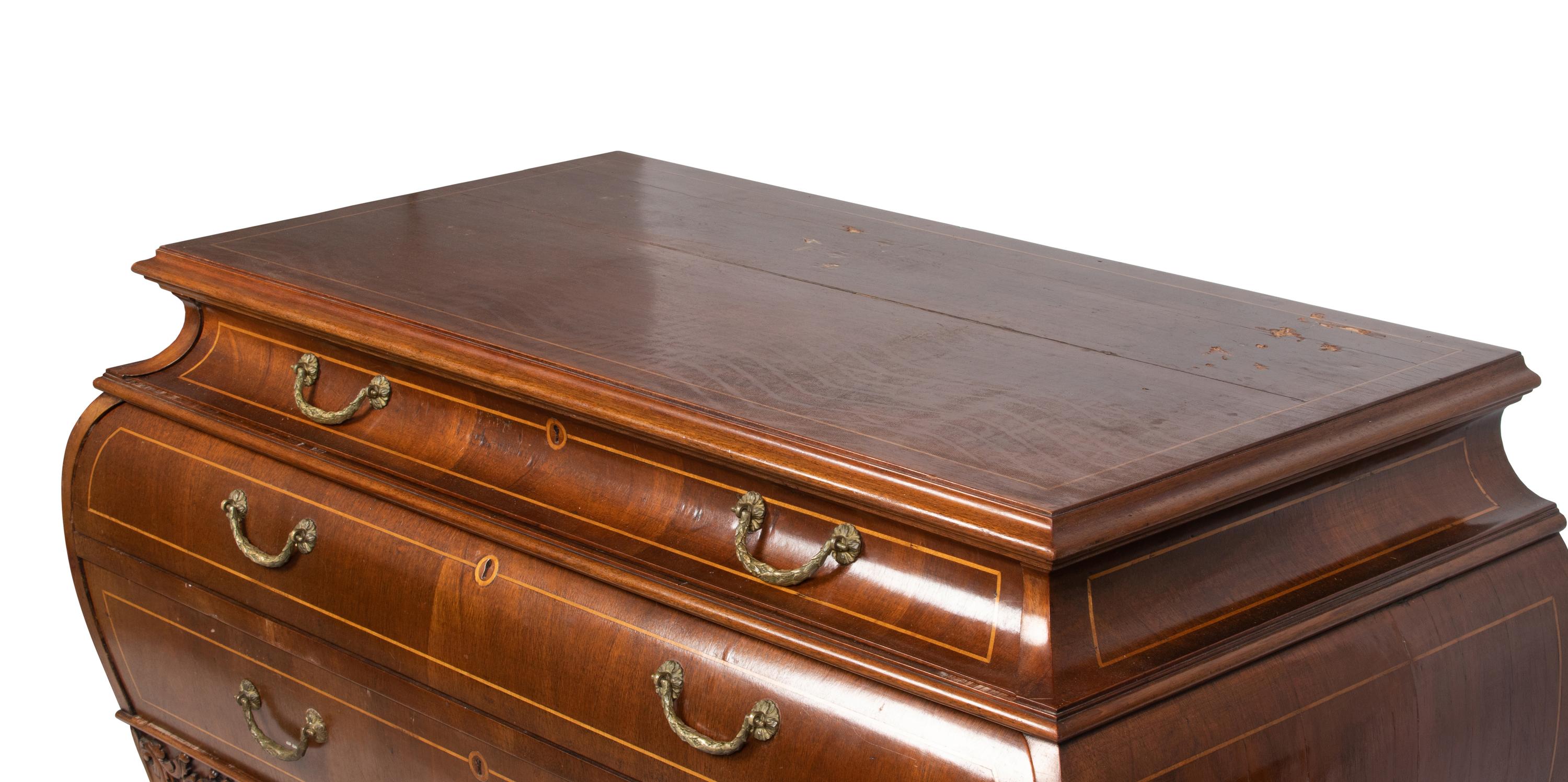 A Louis XV Style Walnut Bombe Commode