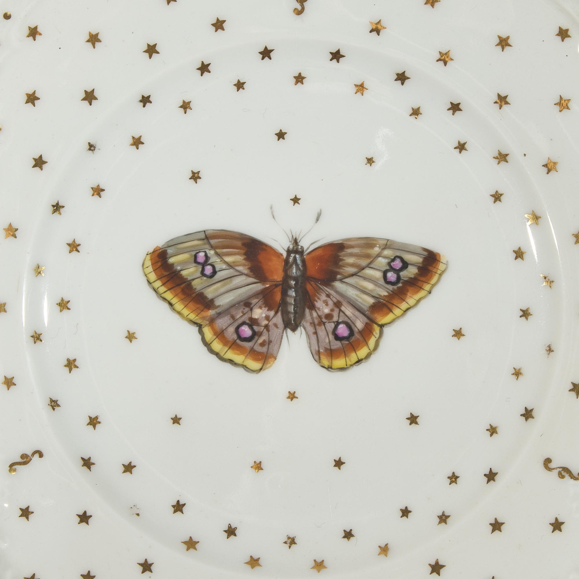 A Set of Nine Paris Porcelain Butterfly Plates