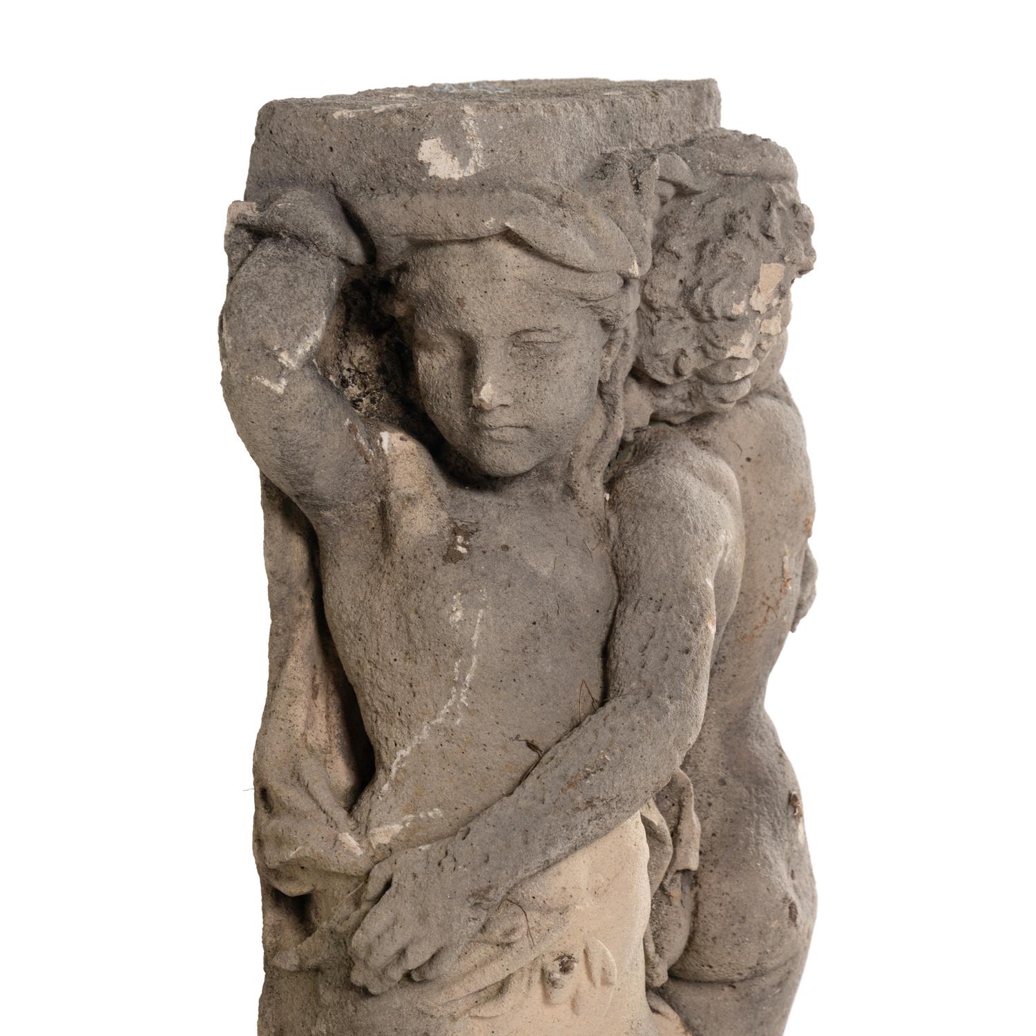 A Cast Stone Garden Figural Group