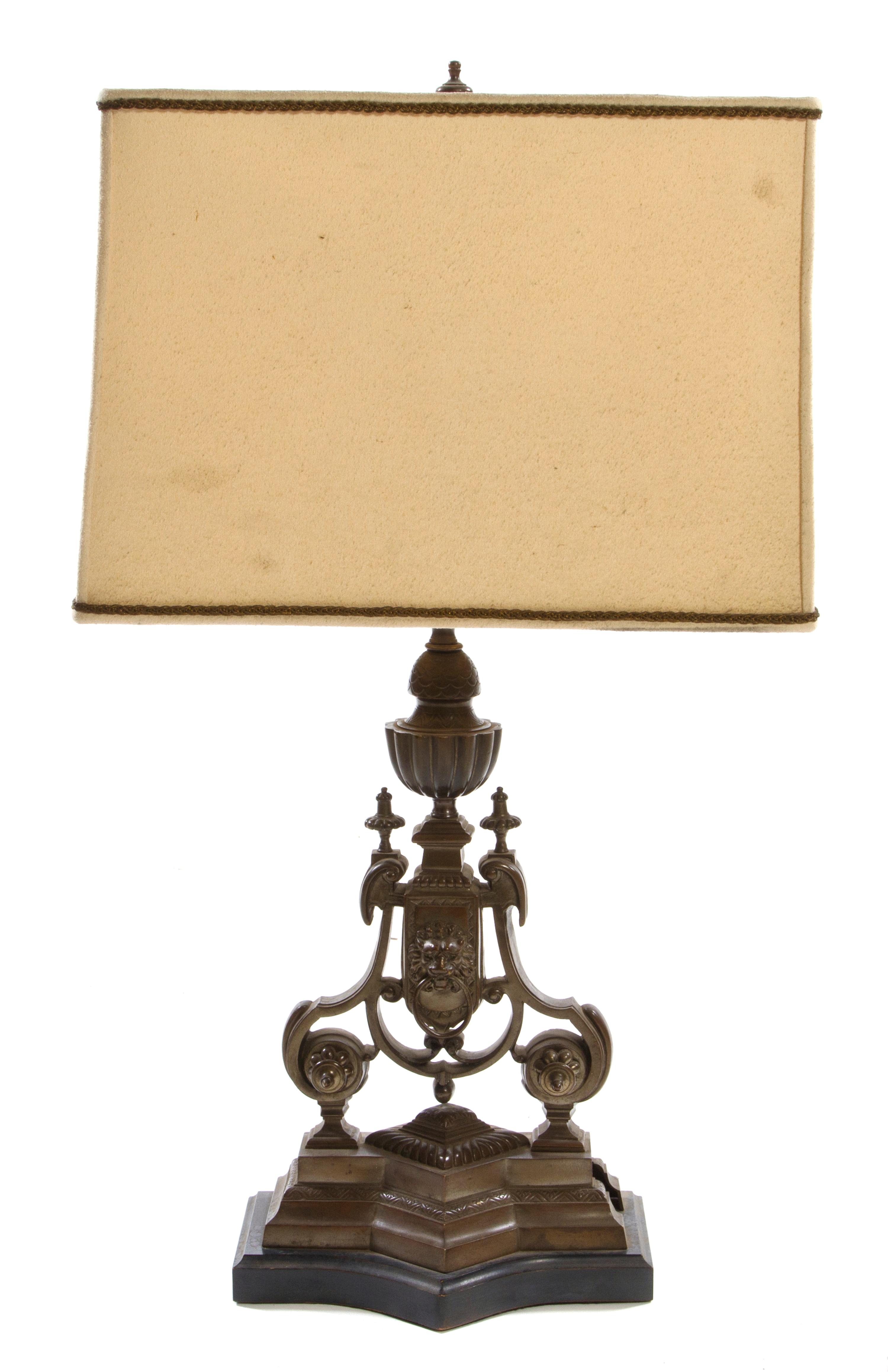 A Neoclassical Style Bronze or Cast Metal Lamp Height overall 31 inches.