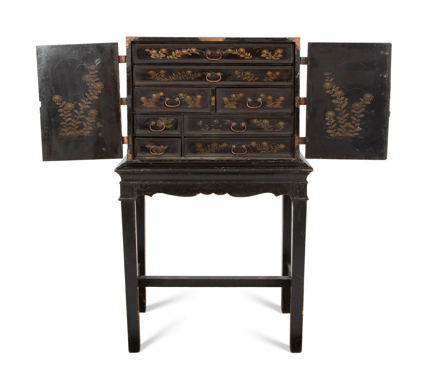 A Chinese Black and Gilt Lacquered Cabinet on Stand