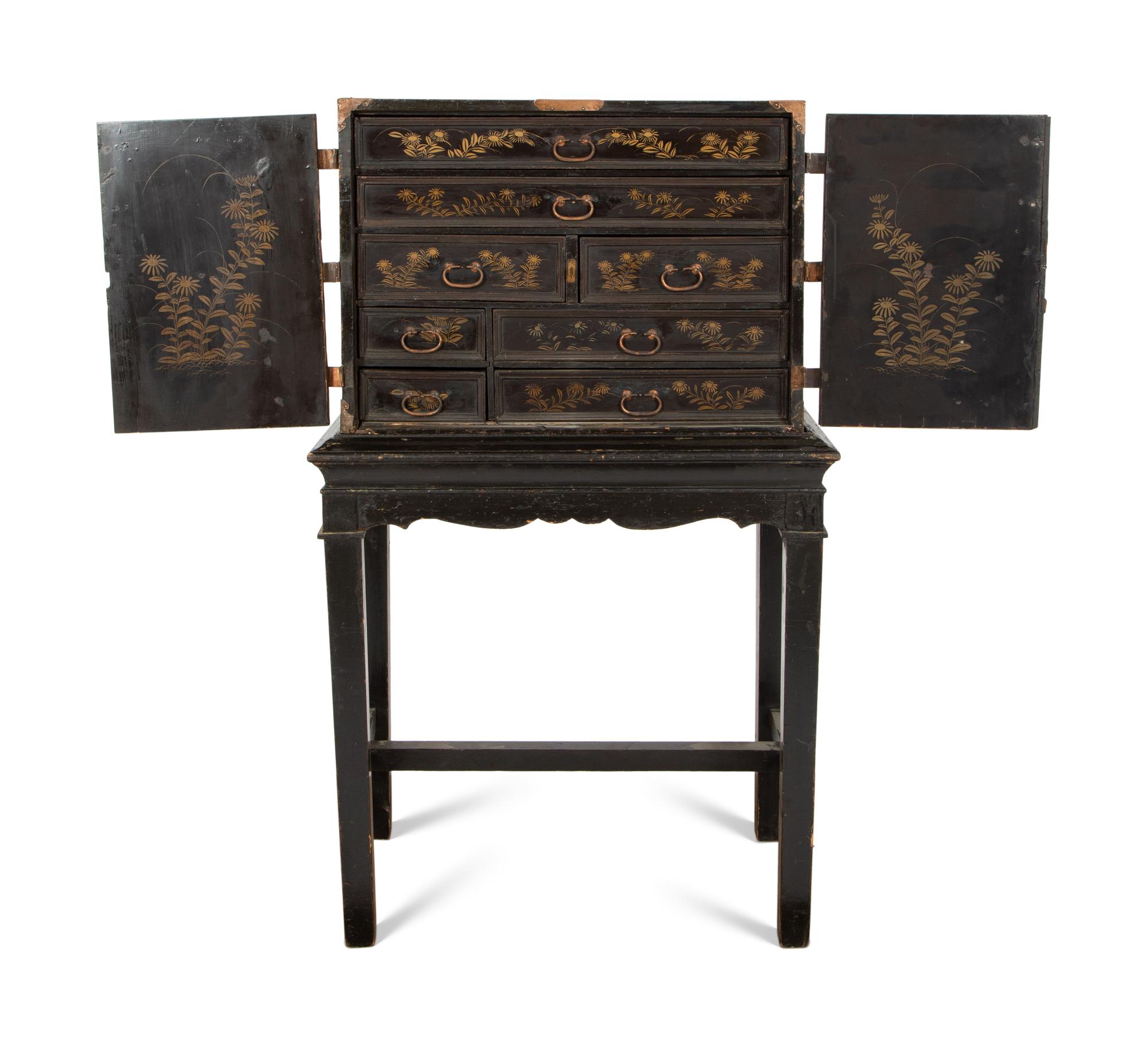 A Chinese Black and Gilt Lacquered Cabinet on Stand