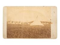 [NATIVE AMERICANS]. CROSS, William R., photographer. A group of 2 CDVs of Sioux subjects including Sitting Bull's prisoner of war camp. Niobrara, NE: n.d.