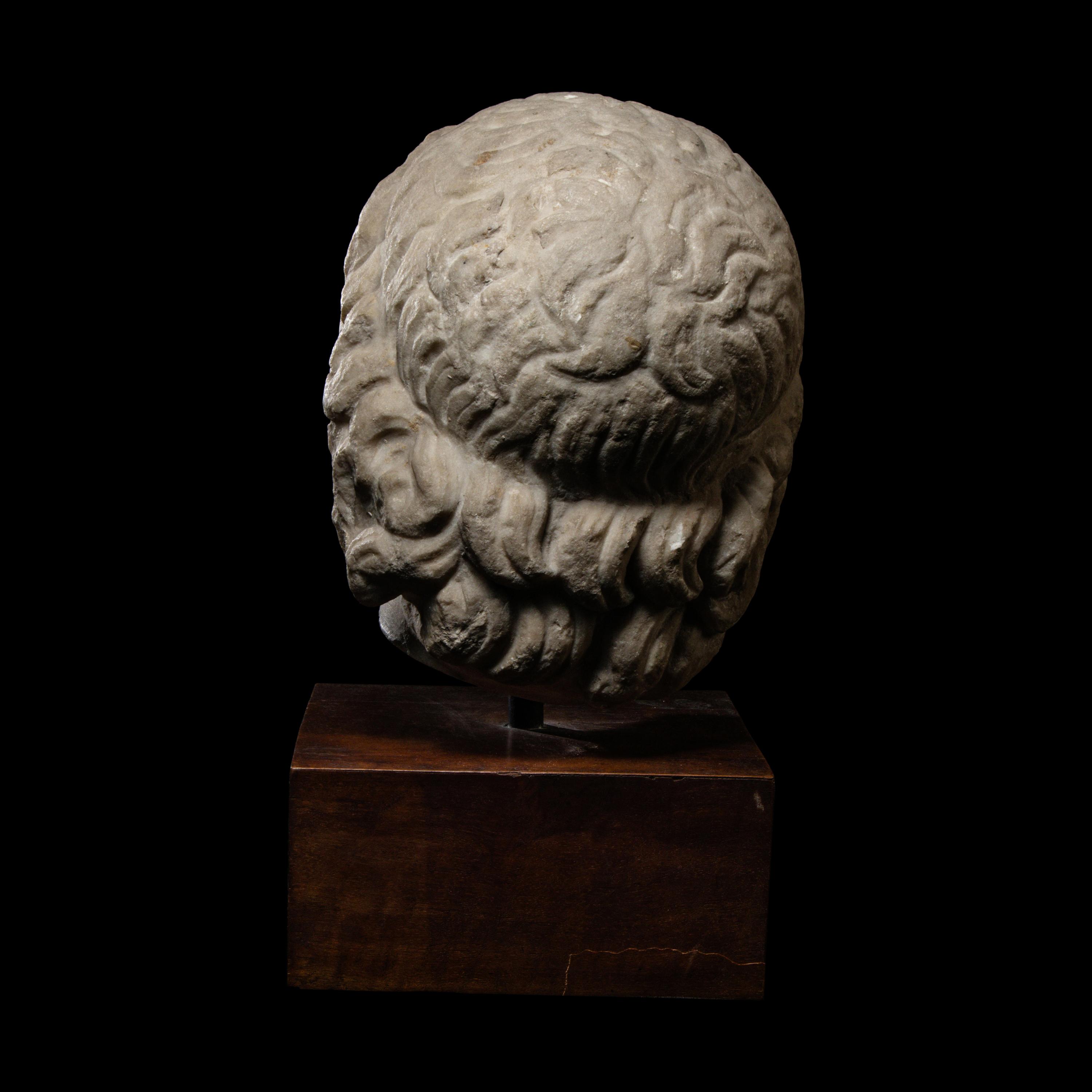 A Roman Marble Head of a Satyr
