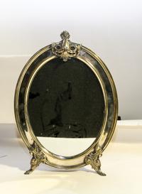 A Continental Silver-Plate Mirror Height 19 1/4 inches.