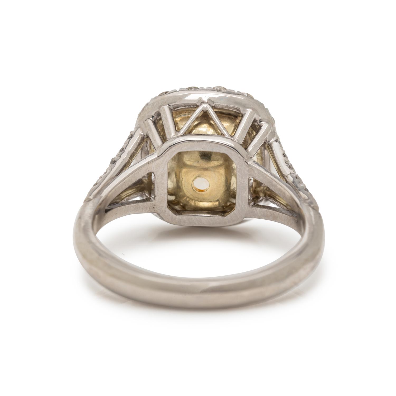 FANCY LIGHT YELLOW DIAMOND AND DIAMOND RING
