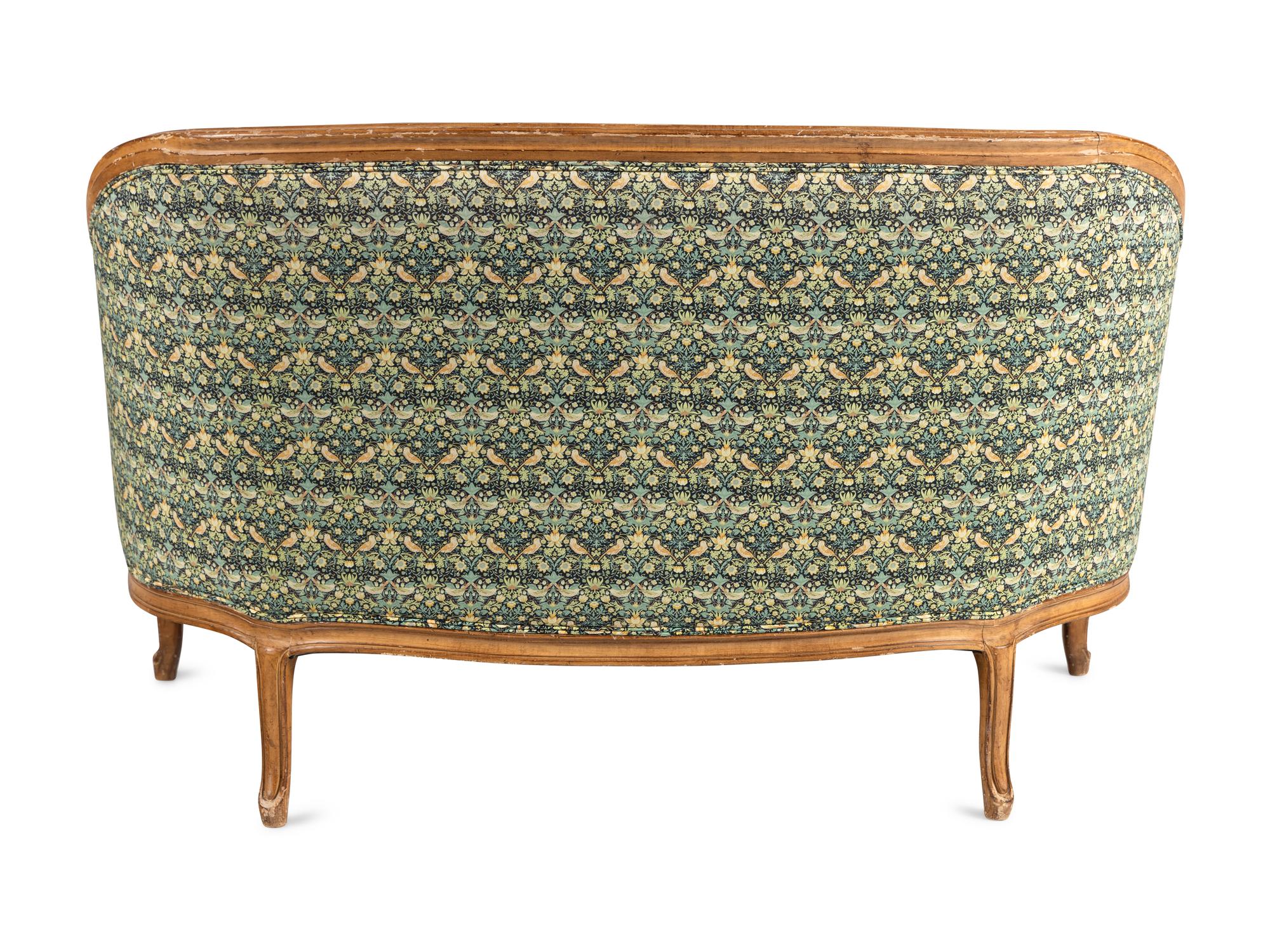 A Louis XV Style Settee with Strawberry Thief Upholstery