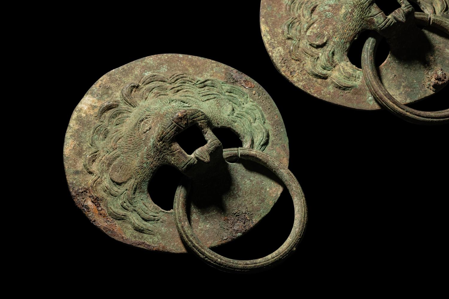 A Pair of Roman Bronze Lion-Headed Handles