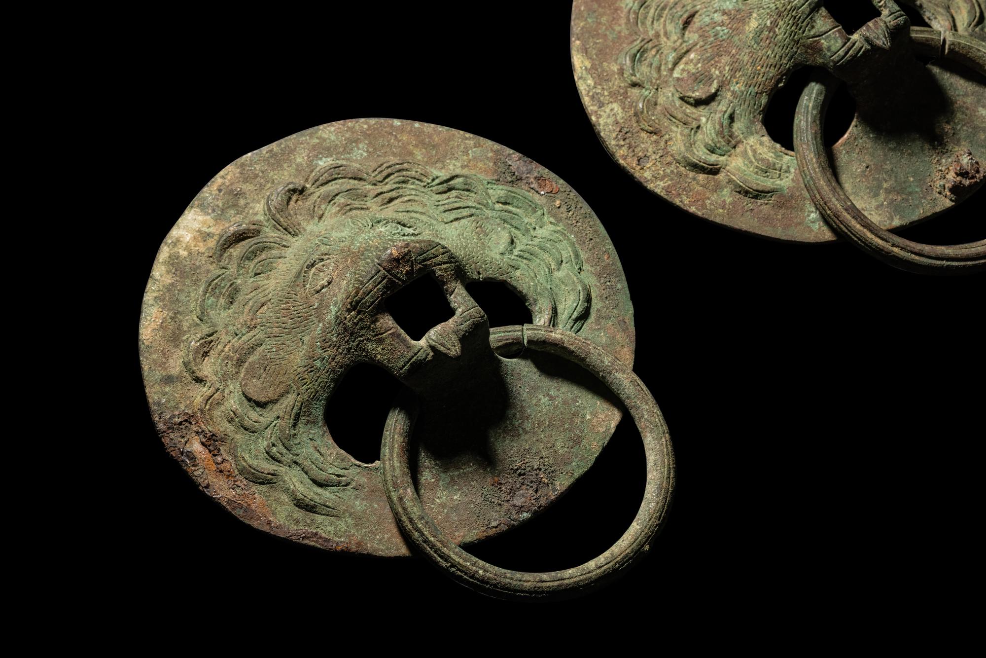 A Pair of Roman Bronze Lion-Headed Handles