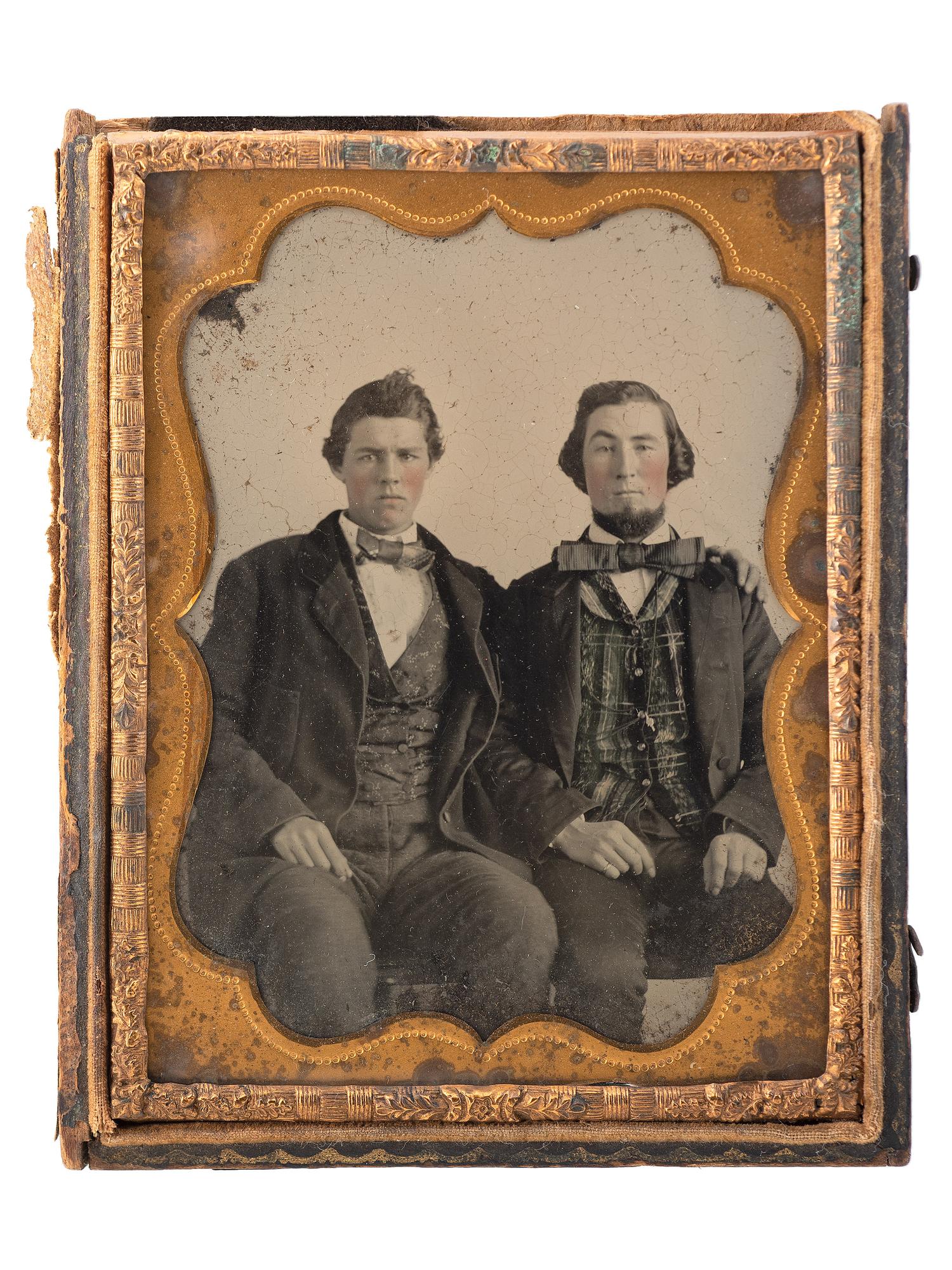 [CIVIL WAR]. Sixth plate ambrotype of CSA soldier John Adams, Jr., possibly from Company, B, 16th South Carolina Volunteers, holding a Confederate-made Spiller & Burr revolver, with civilian portrait.