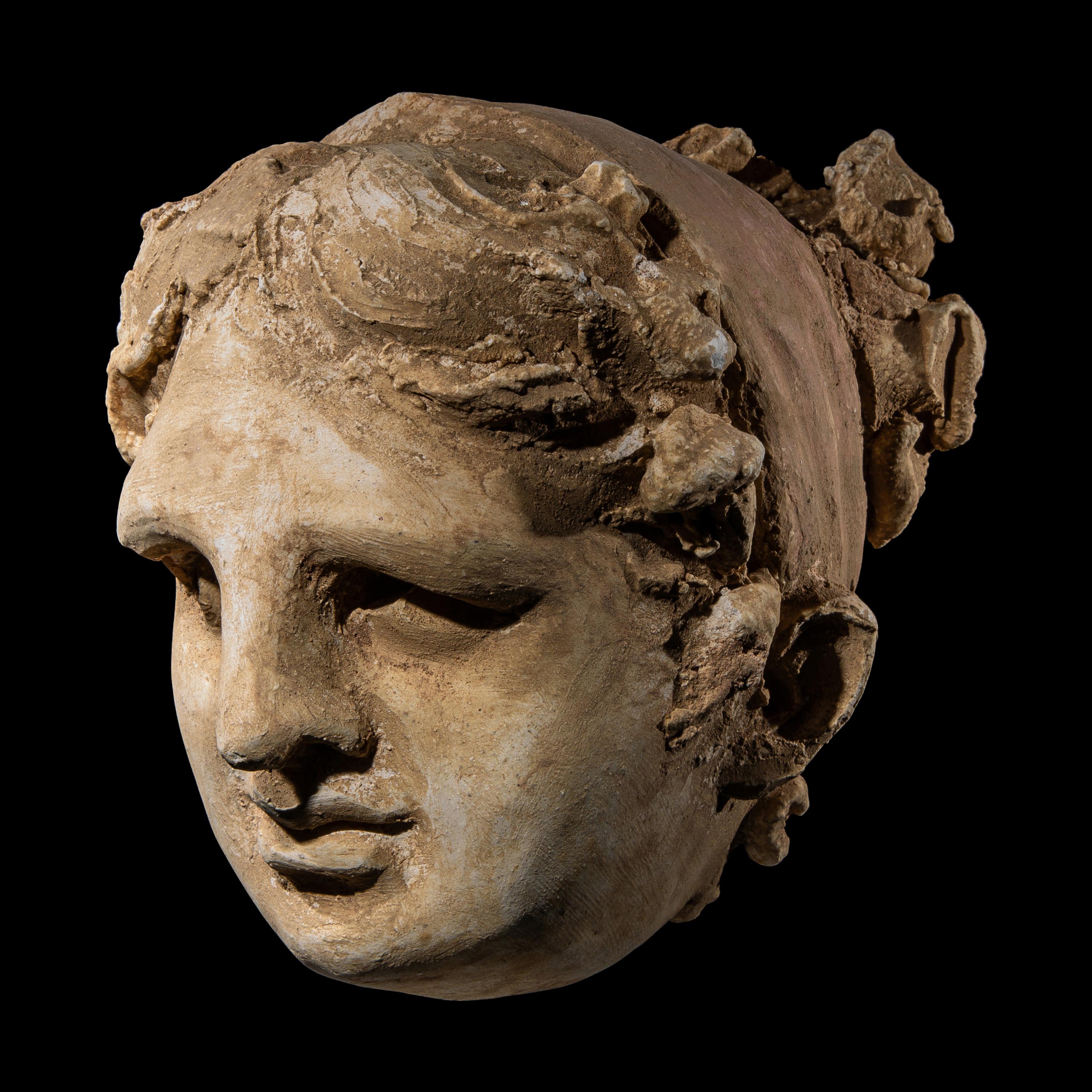 An Eastern Roman Stucco Head of a Woman