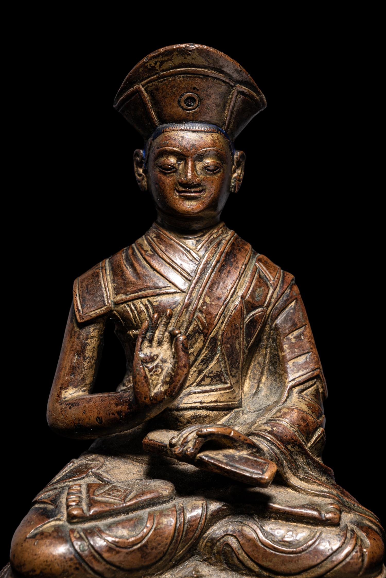 A Tibetan Bronze Figure of a Lama