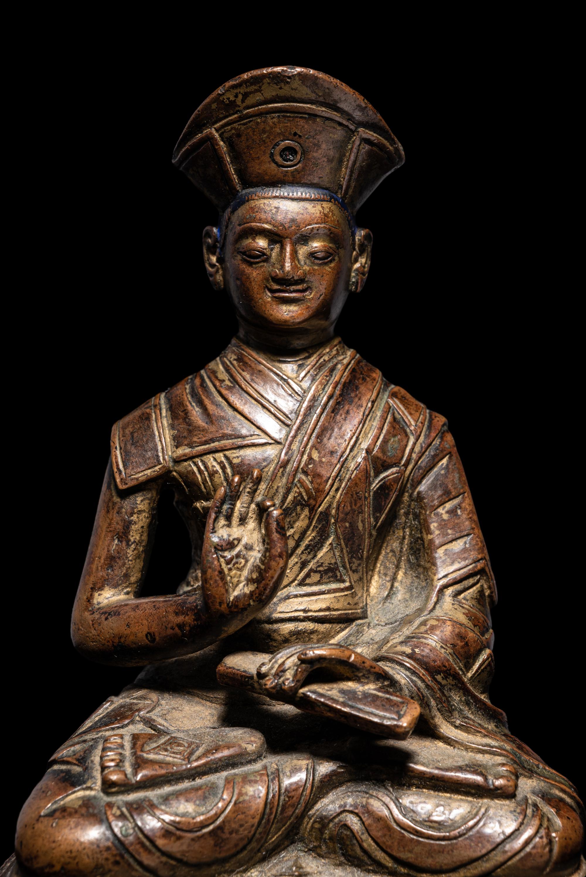 A Tibetan Bronze Figure of a Lama