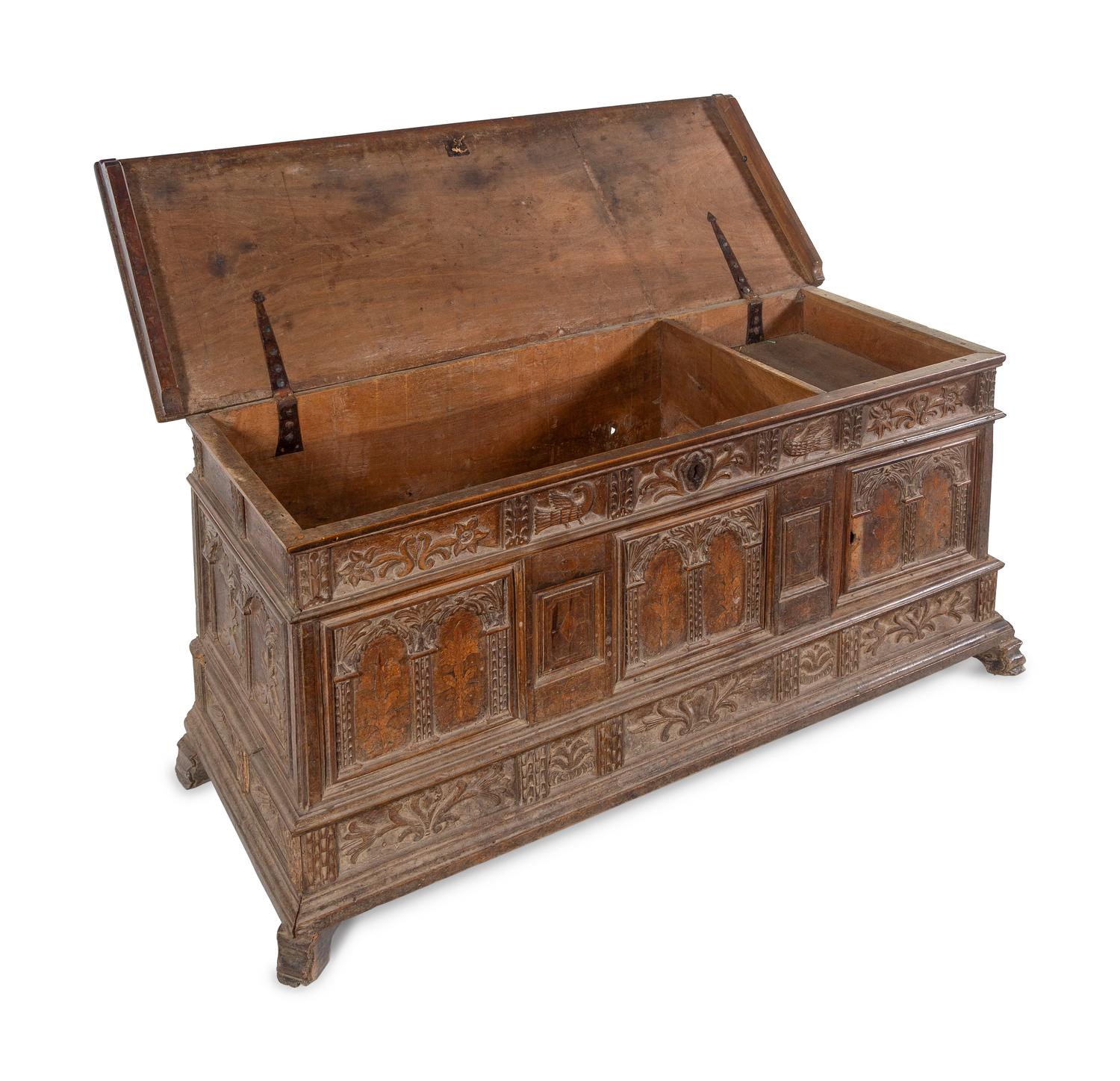 A Continental Carved and Inlaid Walnut Coffer