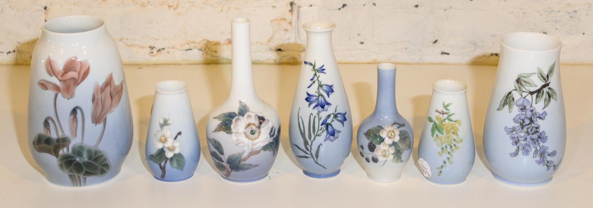 Seven Bing & Grondahl Porcelain Floral Decorated Vases. Height of tallest 7 1/2 inches.