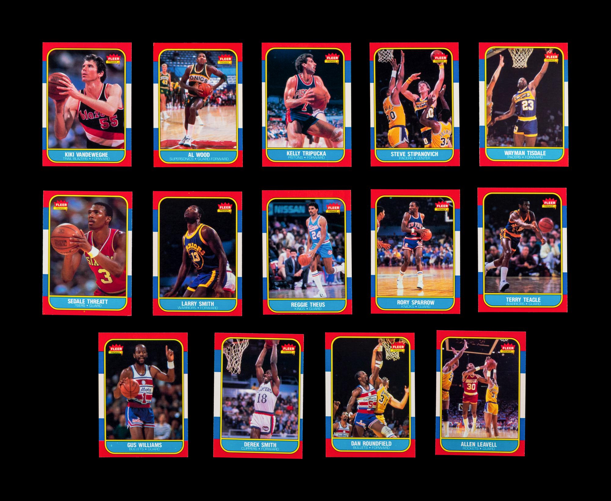 A Group of 54 1986 Fleer Basketball Cards, Including a Patrick Ewing Rookie No. 32, and Two Stickers