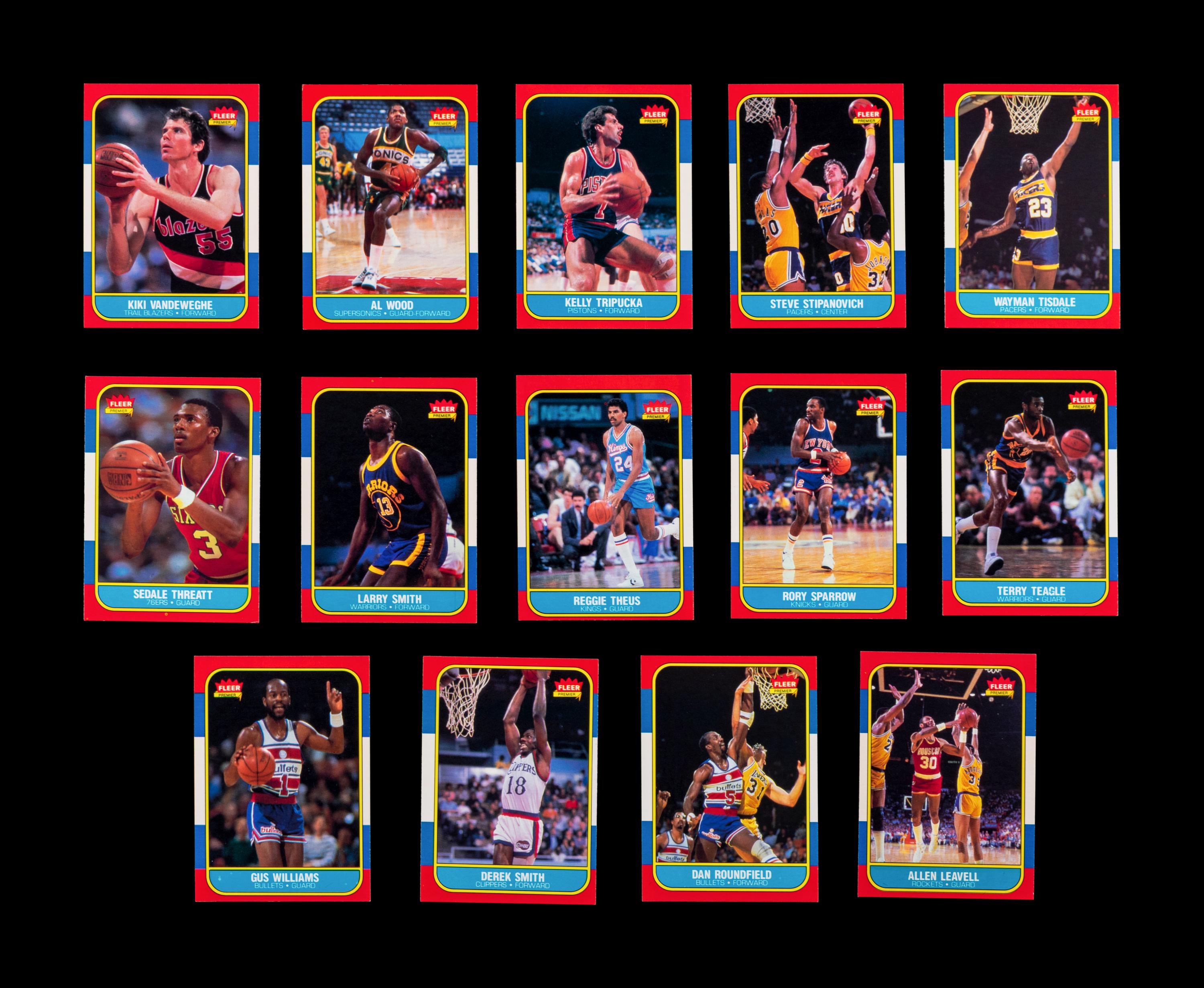 A Group of 54 1986 Fleer Basketball Cards, Including a Patrick Ewing Rookie No. 32, and Two Stickers