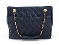 A Chanel Navy Quilted Leather Tote Handbag, 12" x 8" x 2"; Strap drop: 7".