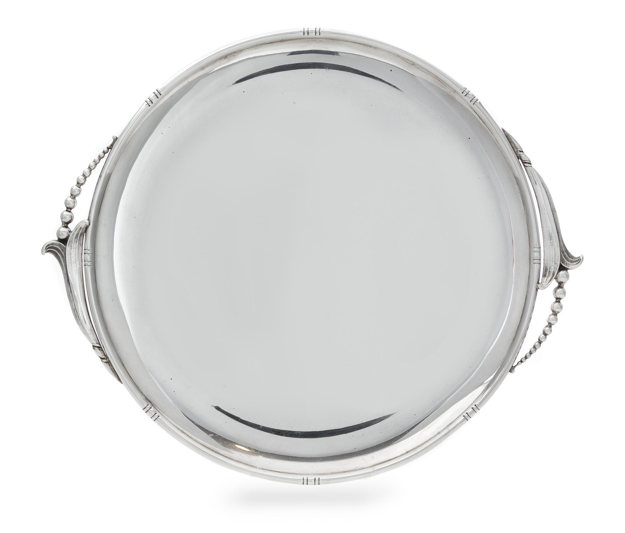 An American Silver Serving Tray, Woodside Sterling Co., New York, NY, Early 20th Century, of circular form with blossom form handles.
