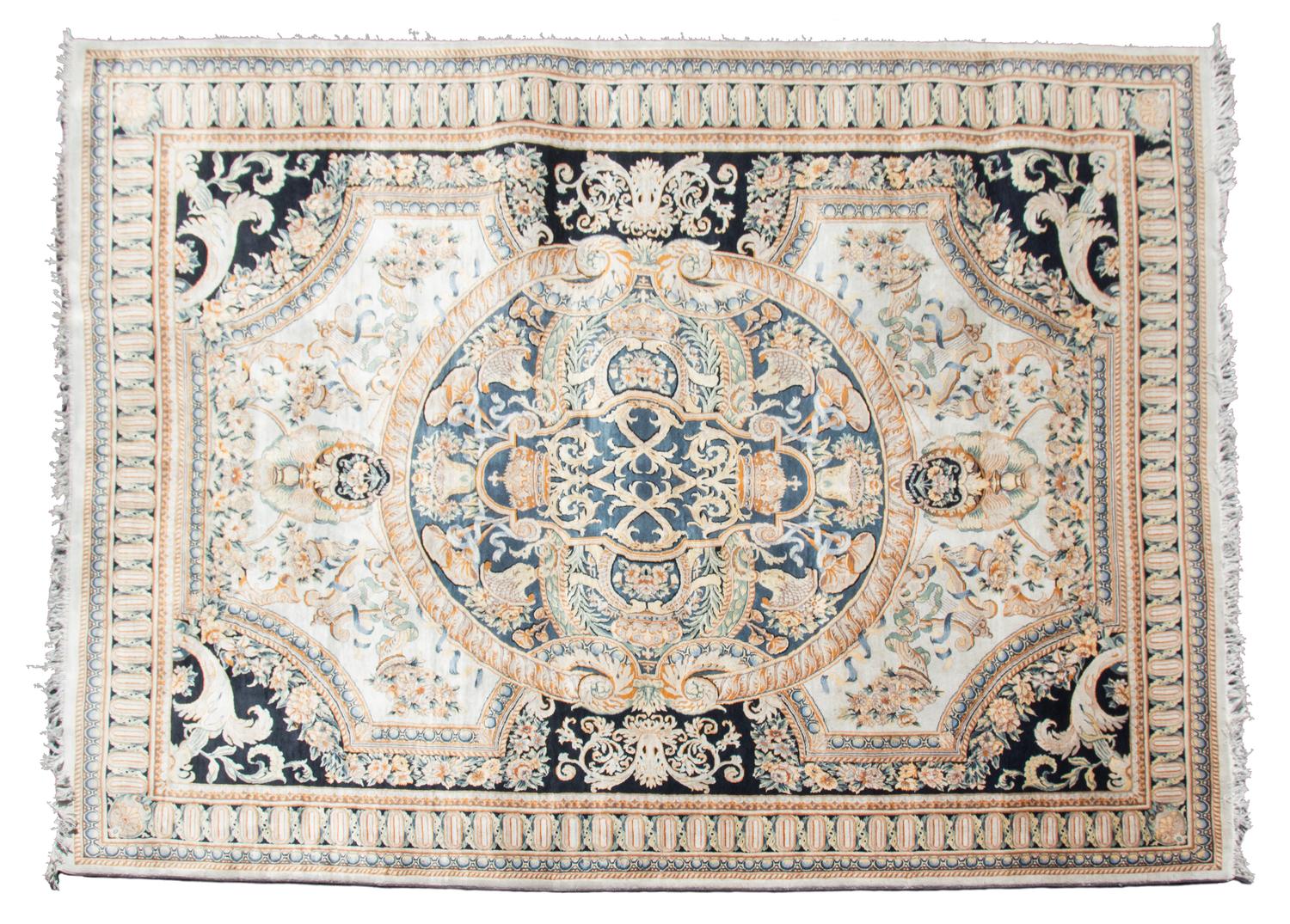 A Louis XVI Design Wool Rug by Safavieh 12 feet 5 inches x 9 feet.